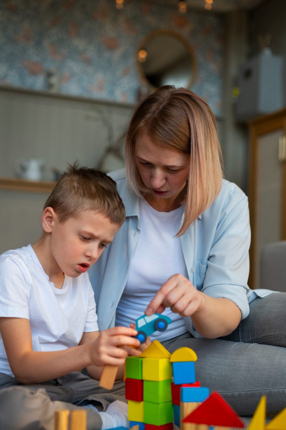 Woman and child playing with blocks